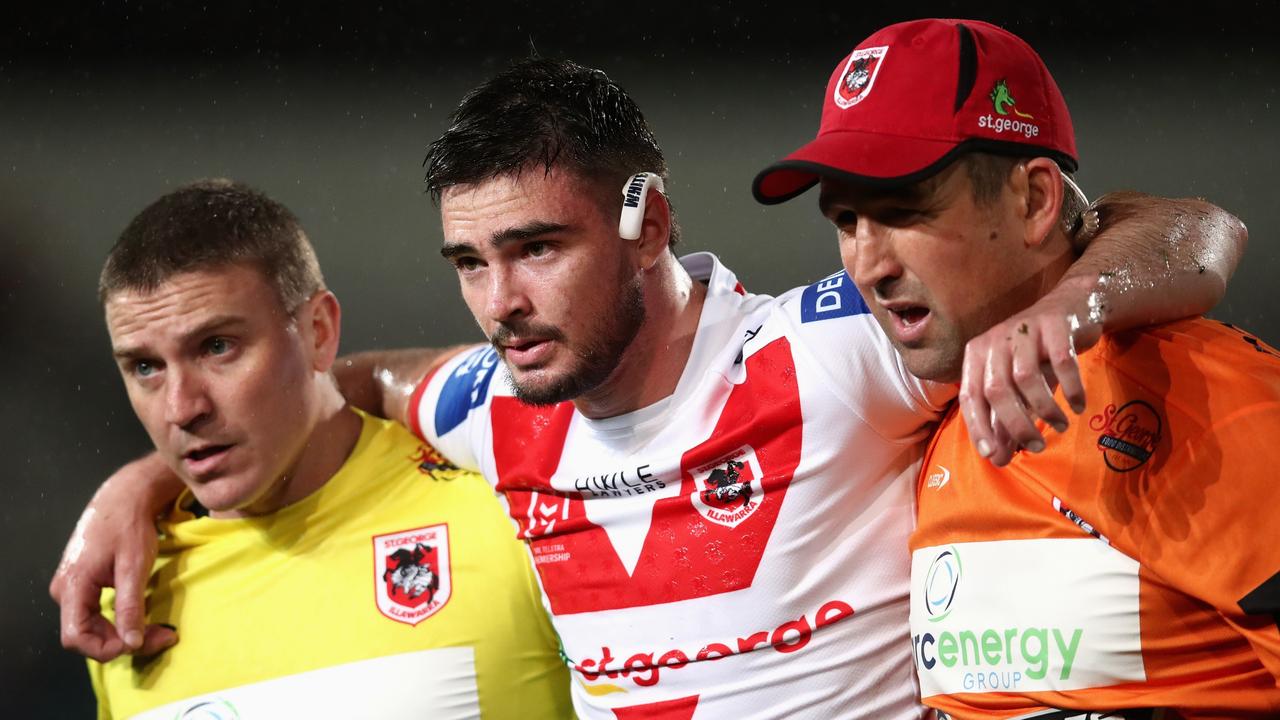 Cody Ramsey of the Dragons is assisted from the field after injuring his knee last year.