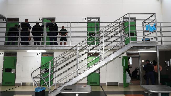 Officers and inmates during the contraband raid on December 11. Picture: Peter Lorimer