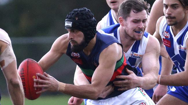 EDFL: Northern Saints’ Mahmoud El-Achkar gets his arms free. Picture: Hamish Blair