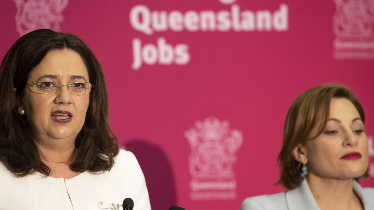 Queensland Premier Annastacia Palaszczuk (left) and Treasurer Jackie Trad speak during the state government's 2019-20 Queensland budget media briefing in Brisbane. Picture: Glenn Hunt/AAP.