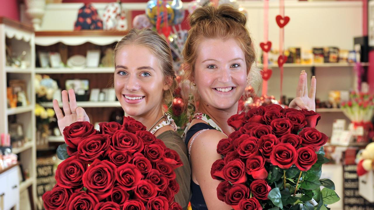 Kelly Dogtash and Samantha Gray selling flowers for Valentine's Day. Photo Stewart Allen