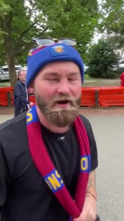 Brisbane Lions fans react after winning the 2024 grand final