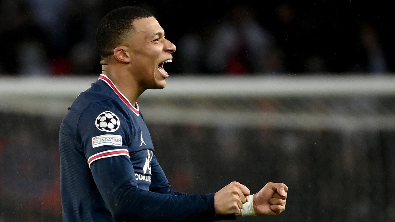 Kylian Mbappe celebrates after scoring the winner for PSG against Real Madrid. (Photo by FRANCK FIFE / AFP)