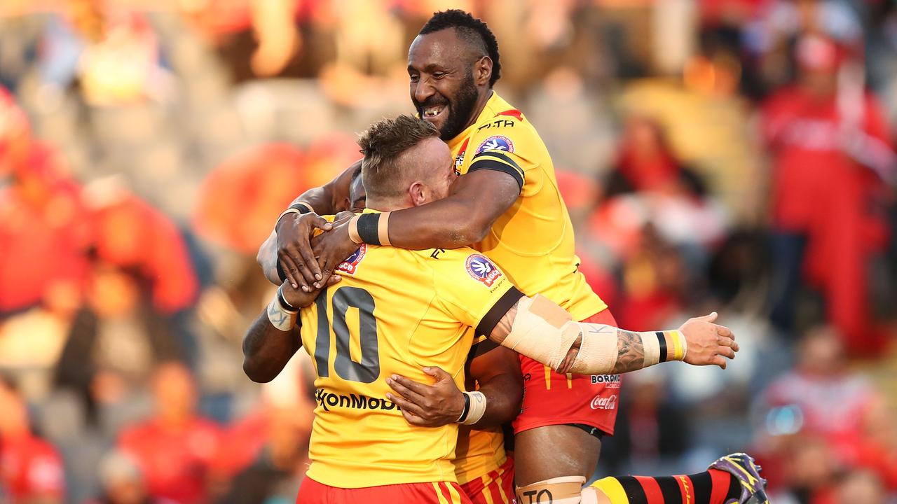 SYDNEY, AUSTRALIA - JUNE 23: Luke Page of PNG celebrates with teammates after scoring a try during the 2018 Pacific Test Invitational match between Fiji and Papua New Guinea at Campbelltown Sports Stadium on June 23, 2018 in Sydney, Australia. (Photo by Brendon Thorne/Getty Images)