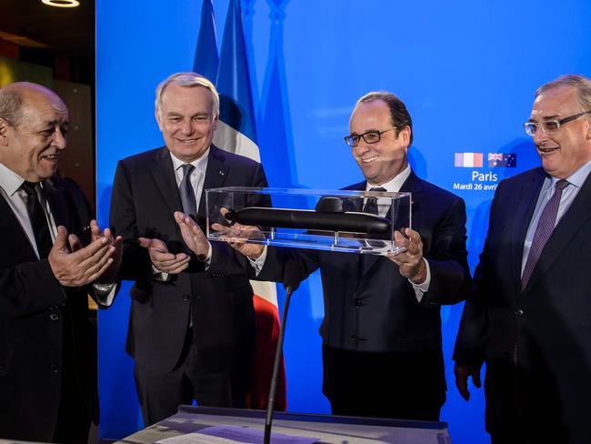 French President Francois Hollande with a model submarine from French naval defence contractor DCNS which has been awarded a $50 billion contract from Australia. Picture: AFP/Christophe Petit Tesson