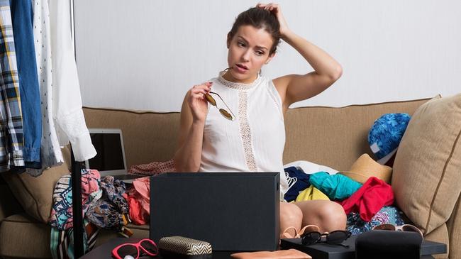 RendezView. Young hipster woman sorting her wardrobe. (Pic: iStock)