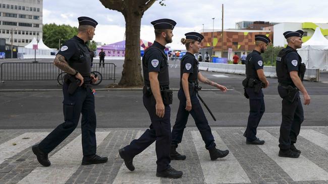 Police walk at Seine-Saint-Denis near the Athletes' Village ahead of the Paris Olympic Games on July 23. (Photo by Maja Hitij/Getty Images)