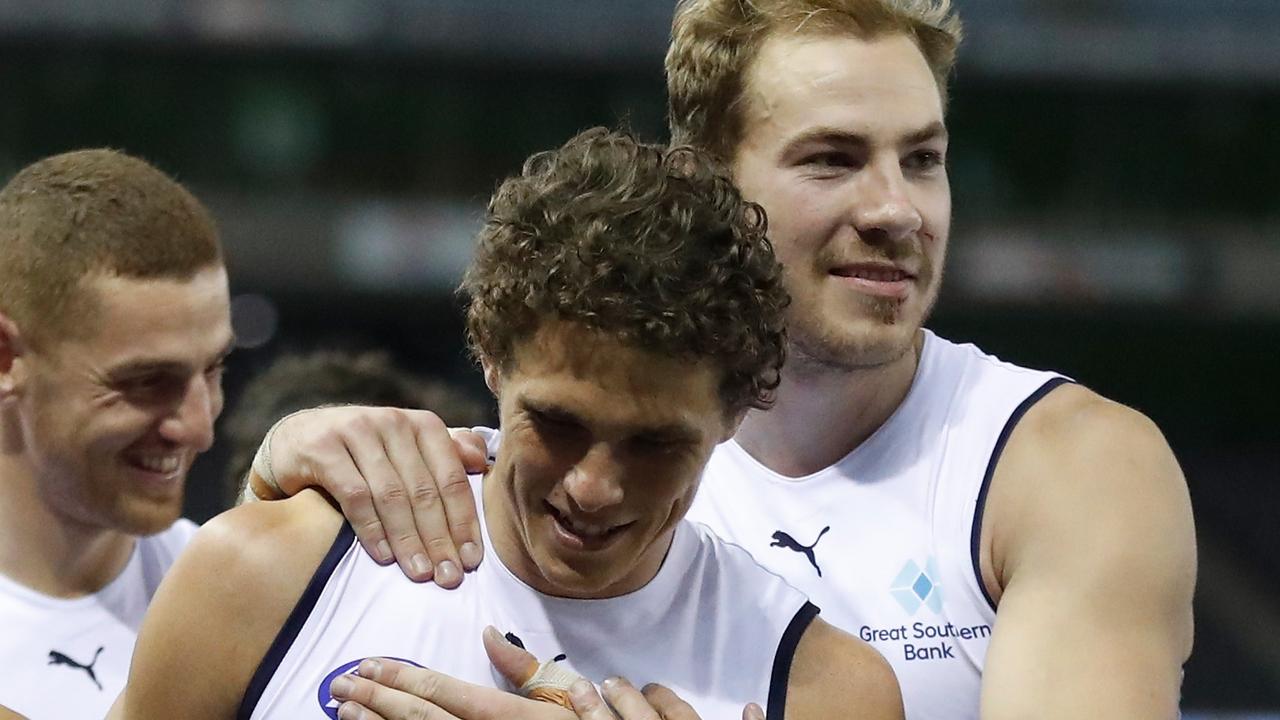 Comeback kid Charlie Curnow is congratulated by Harry McKay as the Blues keep their dream alive.