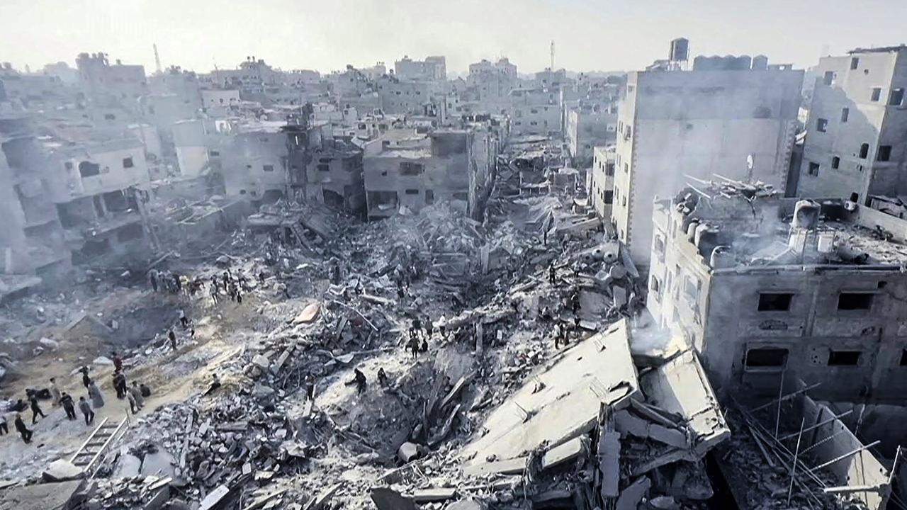 Palestinians survey the destruction after an Israeli strike on the Jabalia refugee camp. Picture: AFP