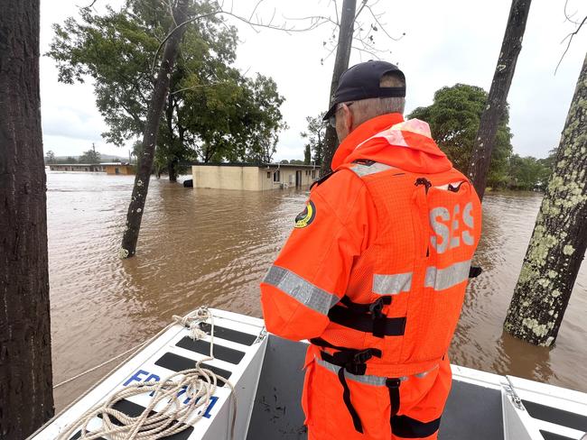 SES volunteers in the mid-north coast town of Taree where flood waters have cut off thousands of people and one man has died. Picture: SES