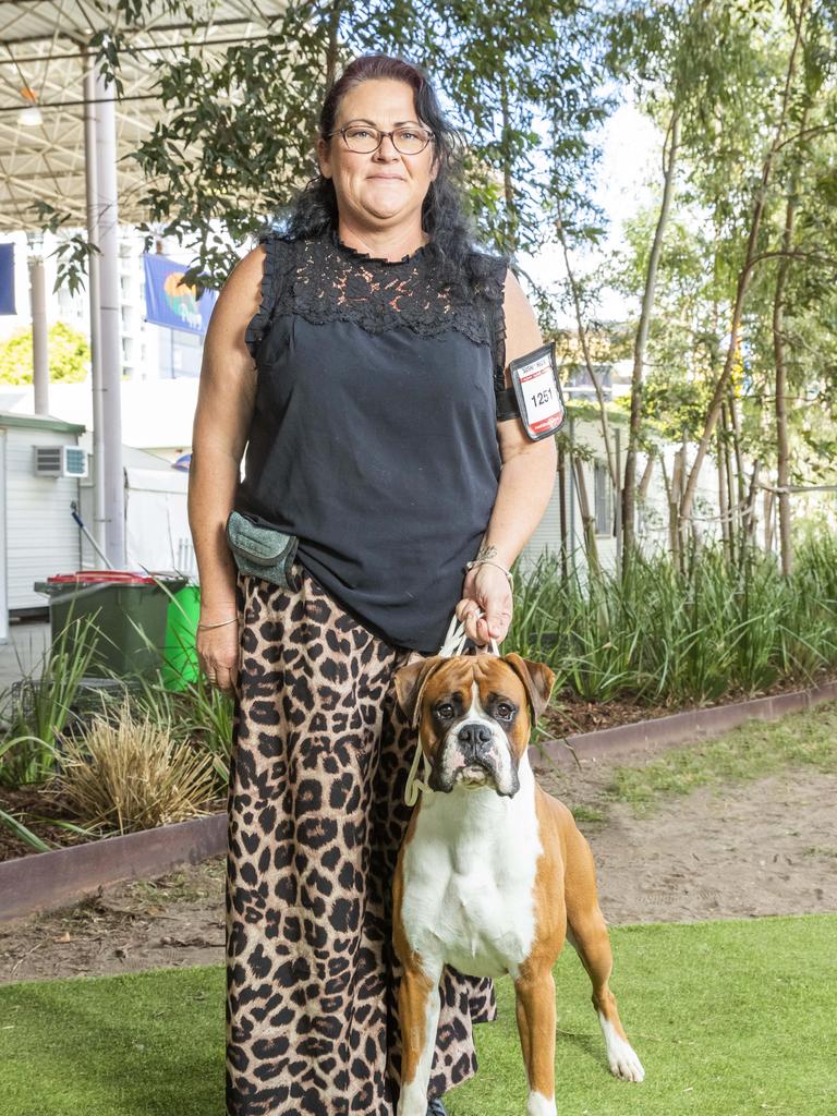 Liza McLaughlin with Charge the Boxer at the Ekka at the RNA Showgrounds in Bowen Hills on Thursday. Picture: Richard Walker