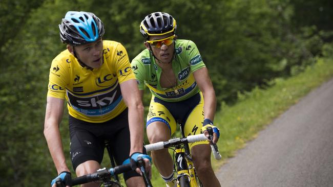 Overall leader Britain's Christopher Froome (L) and Spain's Alberto Contador ride during the second stage of the 66th edition of the Dauphine Criterium cycling race between Tarare and Col du Beal, central France, on June 9, 2014. AFP PHOTO / LIONEL BONAVENTURE