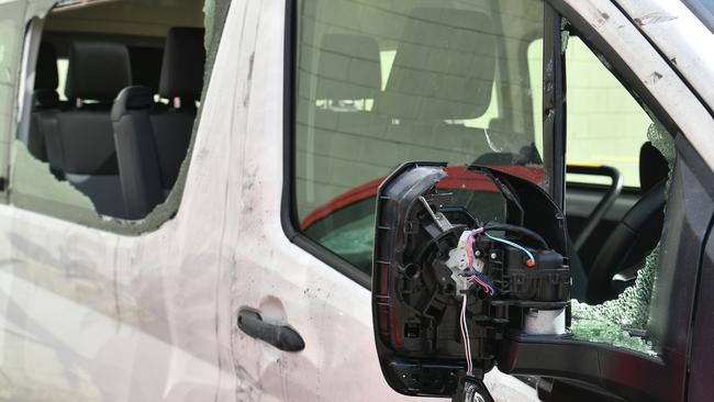 Debbie Thompson at Independent Network in Garbutt with vehicles damaged by a vandal. Picture: Evan Morgan