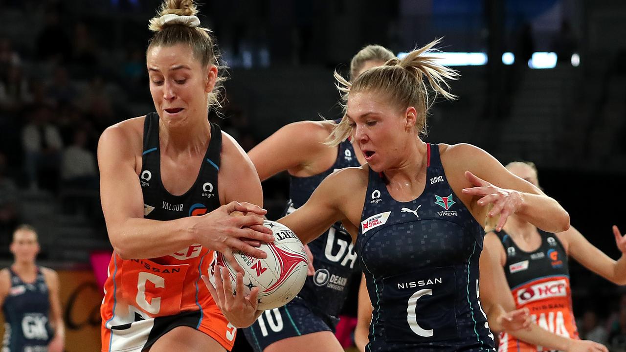 Kate Moloney of the Vixens (right) competes for the ball with Giants centre Jamie-Lee Price. Photo: Getty Images