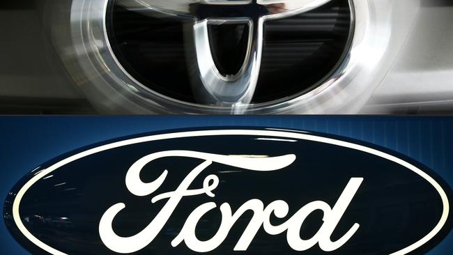 Ford, Toyota and other firms are each giving $US1m. Picture: Saeed Khan, Mandel Ngan/AFP