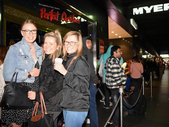 Zina Yakmov from Geelong, Zhenya Yakimov from Geelong and Natasha Paramonov from Spotswood arrive early for the sales. Picture: Nicole Garmston