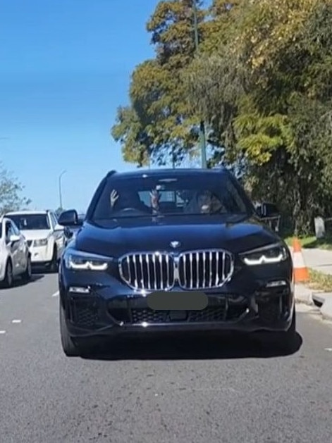 The driver of the car lifted his hands at the driver ahead of them. Picture: TikTok