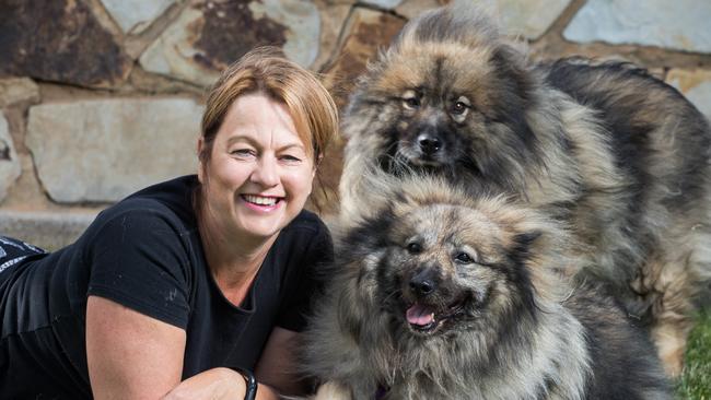 Dog foster carer Tina Williams with dogs Bounty, 10 and his sister Maggie, 10 on the Semaphore foreshore. Picture: Matt Loxton