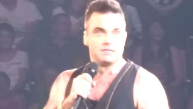 Oops ... Robbie Williams made his gaffe after picking the girl out of the crowd.