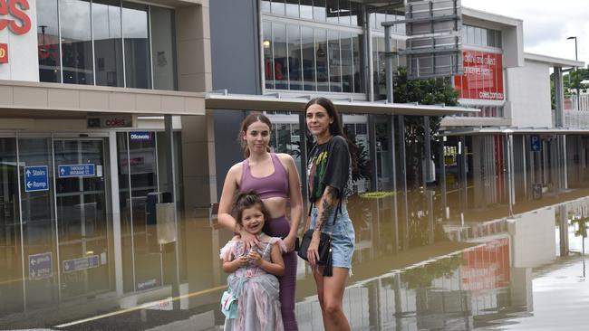 Kristy Lefroy, Sarah Nayler, and five-year-old Ariana Lefroy at Limestone St on Monday. Picture: Jessica Baker