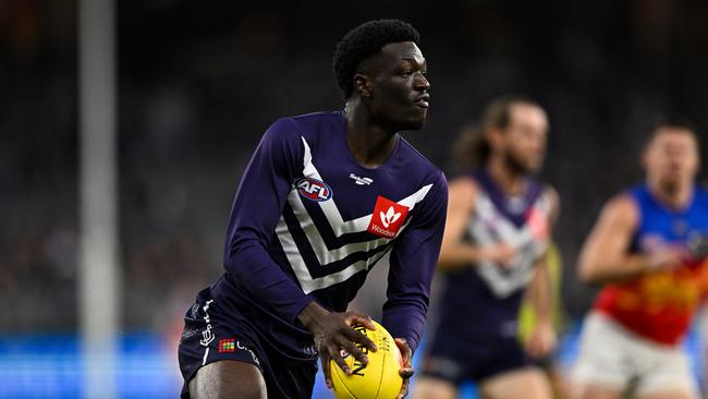 PERTH, AUSTRALIA - JUNE 05: Michael Frederick of the Dockers runs with the ball during the 2022 AFL Round 12 match between the Fremantle Dockers and the Brisbane Lions at Optus Stadium on June 05, 2022 in Perth, Australia. (Photo by Daniel Carson/AFL Photos via Getty Images)