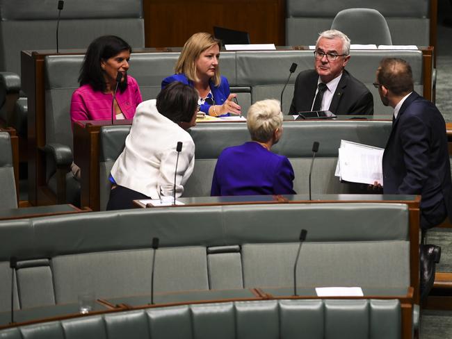 Crossbench MPs Julie Banks, Rebekha Sharkie, Andrew Wilkie, Cathy McGowan, Kerryn Phelps and Adam Bandt discuss the Solicitor-General’s advice after Question Time. Picture: AAP