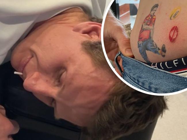 Daniel Gorringe getting his new Gold Coast Suns tattoo