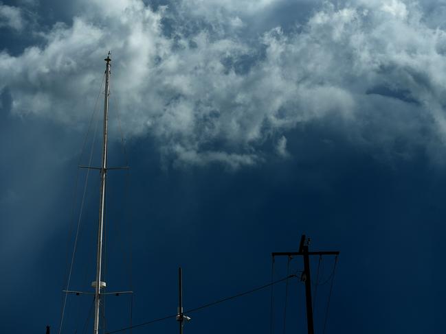 Storm clouds build up as a mast reflects the afternoon sun near Ludmilla Creek on Monday afternoon.Picture: Justin Kennedy