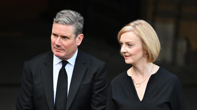 Labour Party leader Sir Keir Starmer and Conservative Prime Minister Liz Truss leave the Palace of Westminster after the presentation of addresses by both houses of Parliament following the death of Queen Elizabeth II in September. Picture: Getty Images