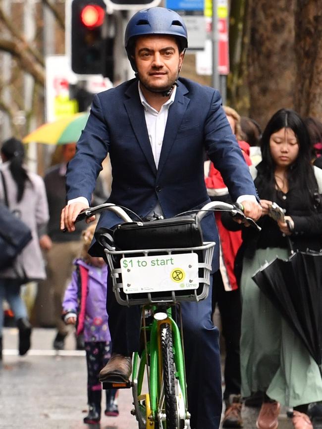 Former ALP senator Sam Dastyari arrives by share bike to give evidence at ICAC yesterday. Picture: AAP