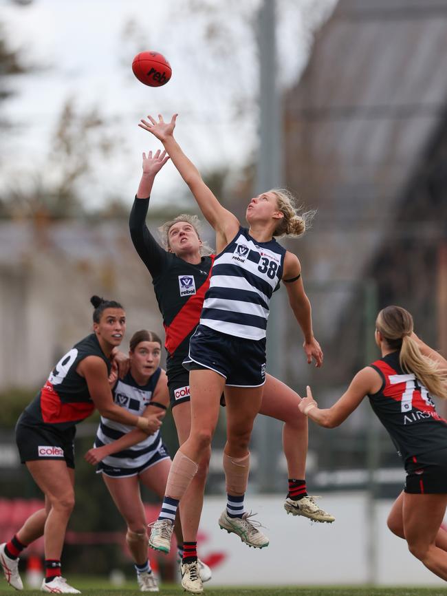 Geelong draftee Piper Dunlop (right) competes in a ruck contest during a VFLW match. Picture: Rob Lawson/AFL Photos