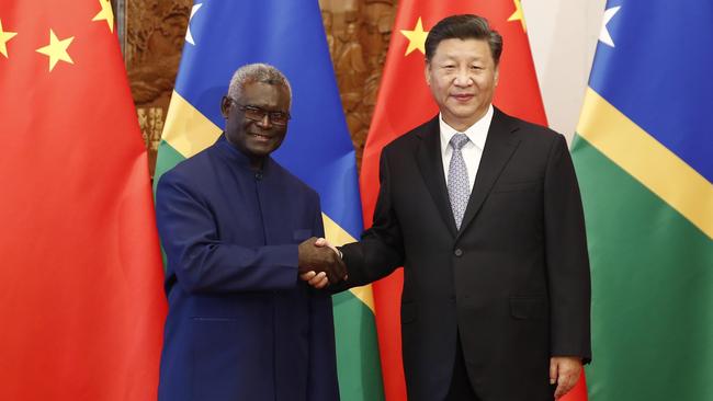 Chinese President Xi Jinping, right, shakes hands with Prime Minister Manasseh Damukana Sogavare of the Solomon Islands in Beijing in 2019. Picture: Getty Images