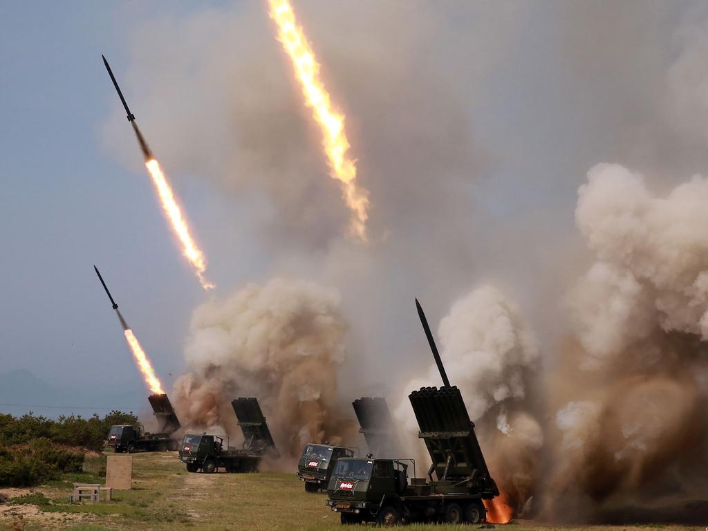 Rocket launchers firing during a test of weapons in an undisclosed location in North Korea. Picture: AFP/KCNA