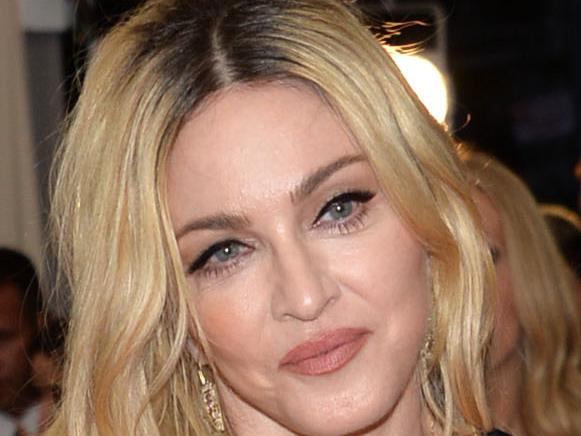 FILE - In this May 4, 2015 file photo, Madonna arrives at The Metropolitan Museum of Art's Costume Institute benefit gala celebrating "China: Through the Looking Glass," in New York. In your quest to find a wife or husband - or a hook-up - you might discover something else when using dating apps: new music. From Madonna to Mariah Carey, more and more acts are looking to platforms like Tinder and Match to promote their music and reach their fans on-the-go. (Photo by Evan Agostini/Invision/AP, File)