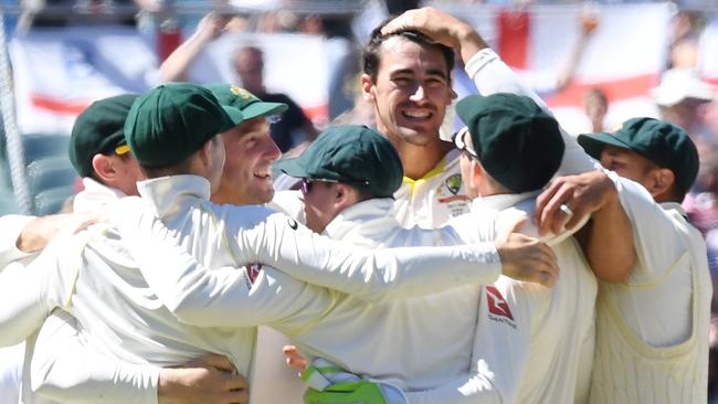 The Australian cricket team celebrate winning the second Ashes Test in Adelaide.