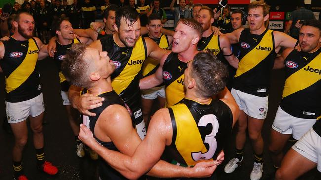 New Tigers Dan Butler, Toby Nankervis, Josh Caddy and Dion Prestia sing the club song.