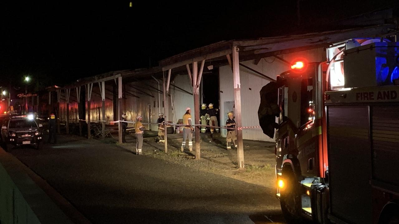 Firefighters and police assess the scene of a building collapse along River Street in Mackay CBD. A 15m by 15m part of the floor has fallen into the Pioneer River. Picture: Rae Wilson