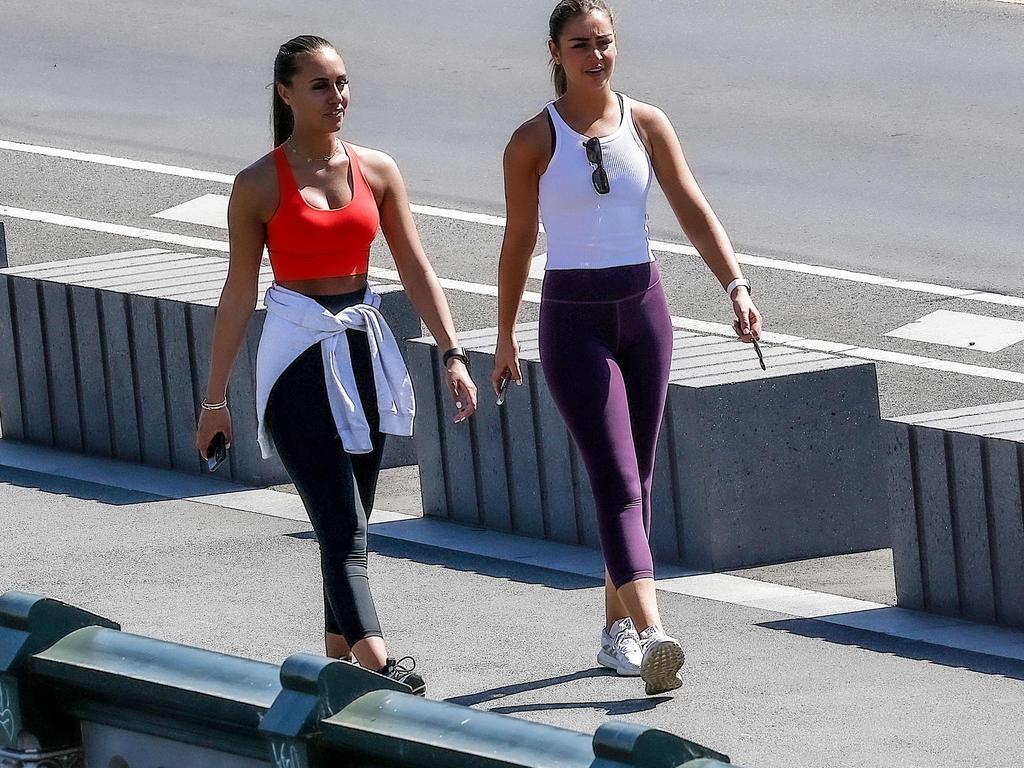 Two women walk across Princes Bridge on Melbourne’s last day of a five-day lockdown. Picture: NCA NewsWire / Ian Currie