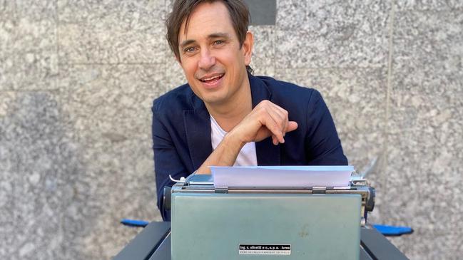 Trent Dalton with his typewriter in Brisbane collecting love stories for his 2021 book, Love Stories