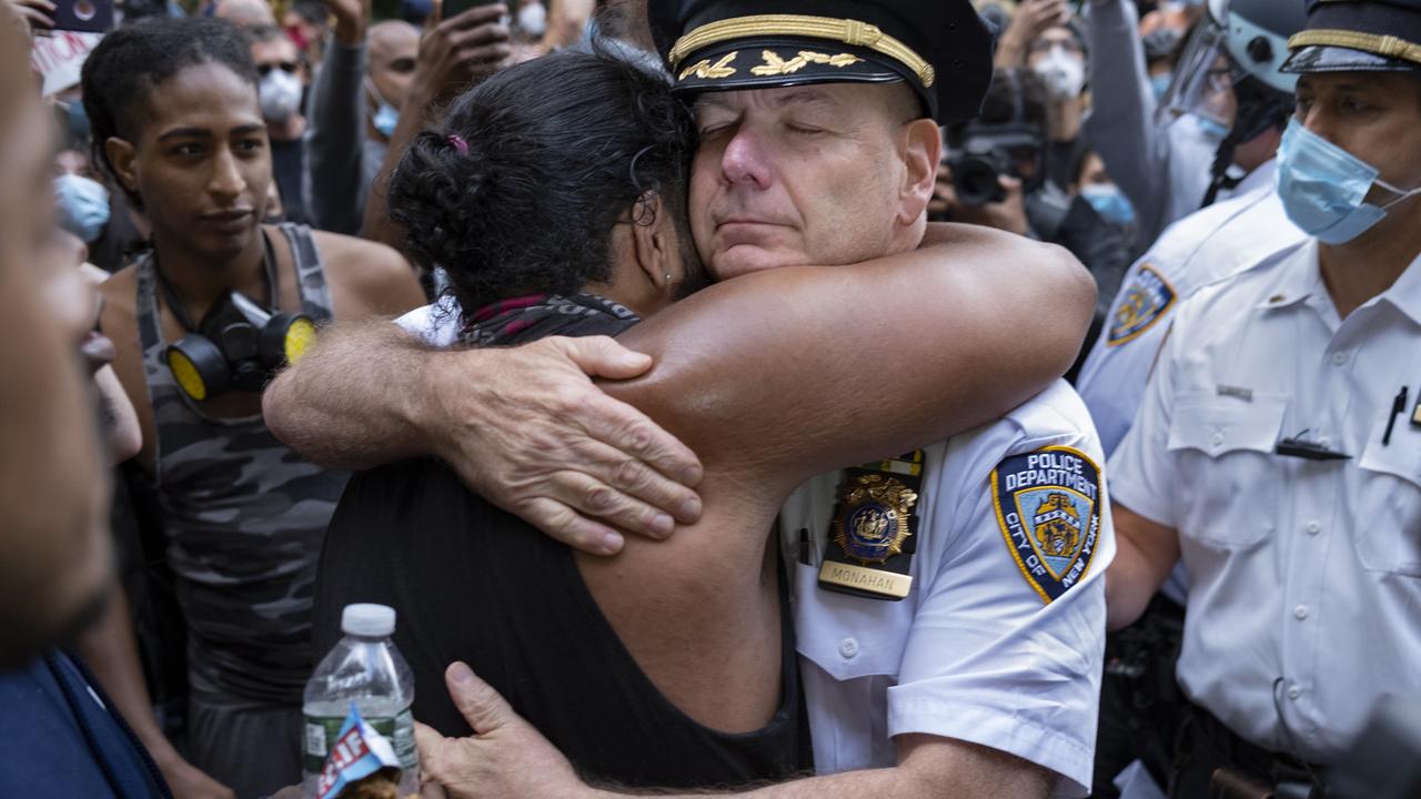 Chief of NYPD Terence Monahan took a knee with protesters and then embraced them. Picture: Craig Ruttle/AP