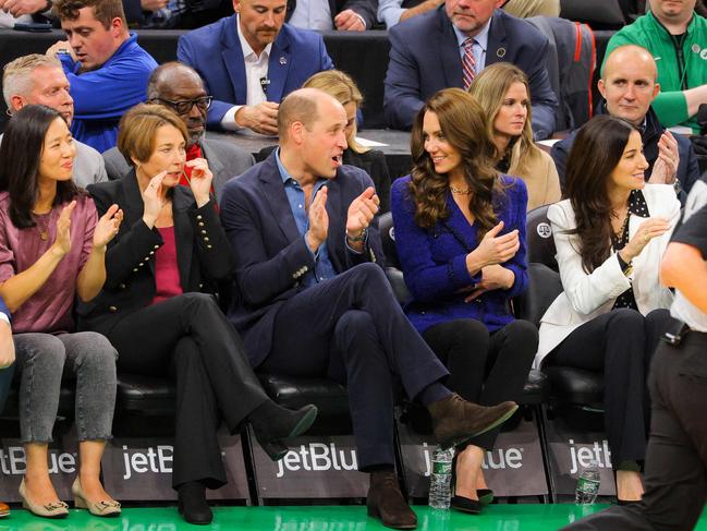 Prince William claps as he gets into the action. Picture: AFP.