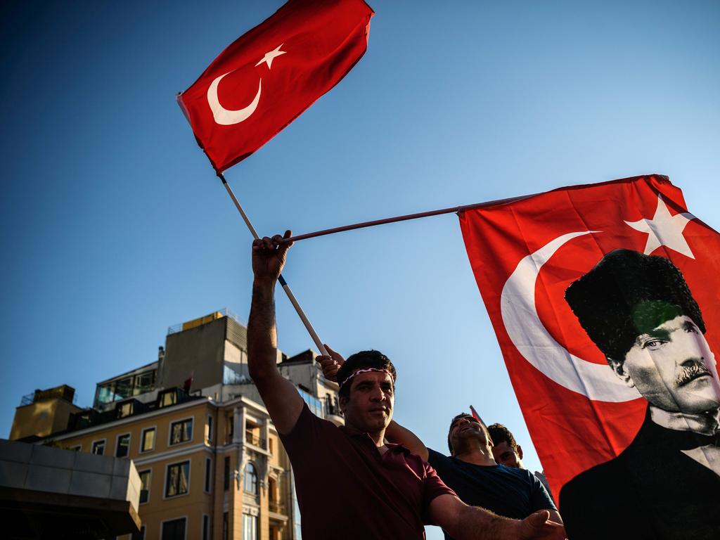 A demonstrator waves a national flag during a protest in Istanbul on July 24, 2016. Many thousands of flag-waving Turks massed on July 24, 2016, for the first cross-party rally to condemn the coup attempt against President Recep Tayyip Erdogan, amid an ongoing purge of suspected state enemies. Several banners also protested the post-coup state of emergency, with one proclaiming “No to the coup, no to dictatorship” and another saying “Turkey is secular and will remain so”. The mass event was called by the biggest opposition group, the secular and centre-left Republican People’s Party (CHP), many of whose members carried pictures of modern Turkey’s founding father Mustafa Kemal Ataturk. Picture: AFP PHOTO / OZAN KOSE