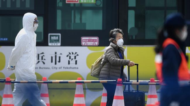 A passenger after disembarking from the Diamond Princess cruise ship, which has been quarantined because of coronavirus. Picture: Charly Triballeau