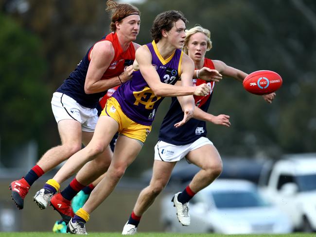 Riley Collier-Dawkins fires out a handball for Oakleigh Chargers. Picture: Mark Dadswell