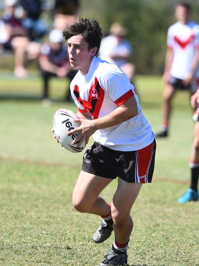 Boys Rugby League State Championship held at Northern Division, Brothers Leagues ground, Townsville. South West (black) v Wide Bay (white). 16-18 years. Ezekiel Monckton of Shalom College.