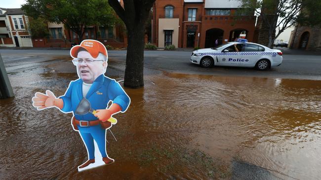 The Advertiser’s Substitute Ian at a burst water main in North Adelaide. Pic: Tait Schmaal