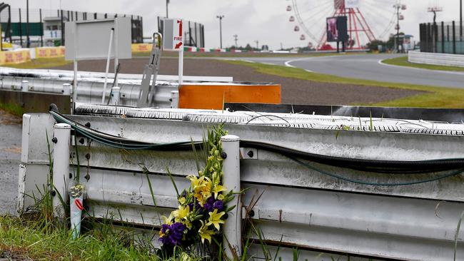 A bouquet of flowers sits at the site where French driver Jules Bianchi crashed and died at the 2014 Japanese Grand Prix. Picture: AFP