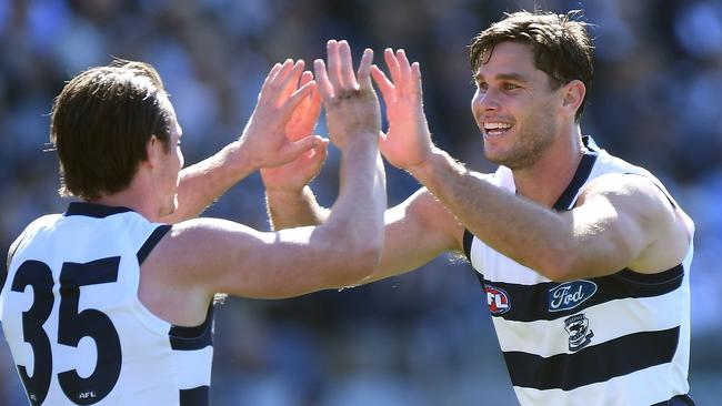 Patrick Dangerfield celebrates another Tom Hawkins goal against the Gold Coast. Picture: AAP Image/Julian Smith