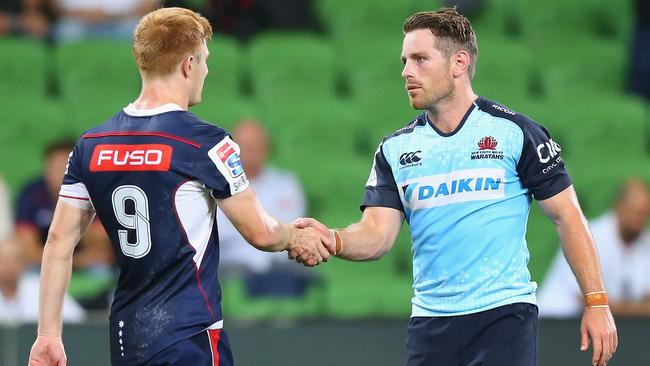 MELBOURNE, AUSTRALIA - MARCH 24: Bernard Foley of the Waratahs is congratulated by Nic Stirzaker of the Rebels (L) after scoring the winning try during the round five Super Rugby match between the Rebels and the Waratahs at AAMI Park on March 24, 2017 in Melbourne, Australia. (Photo by Michael Dodge/Getty Images)