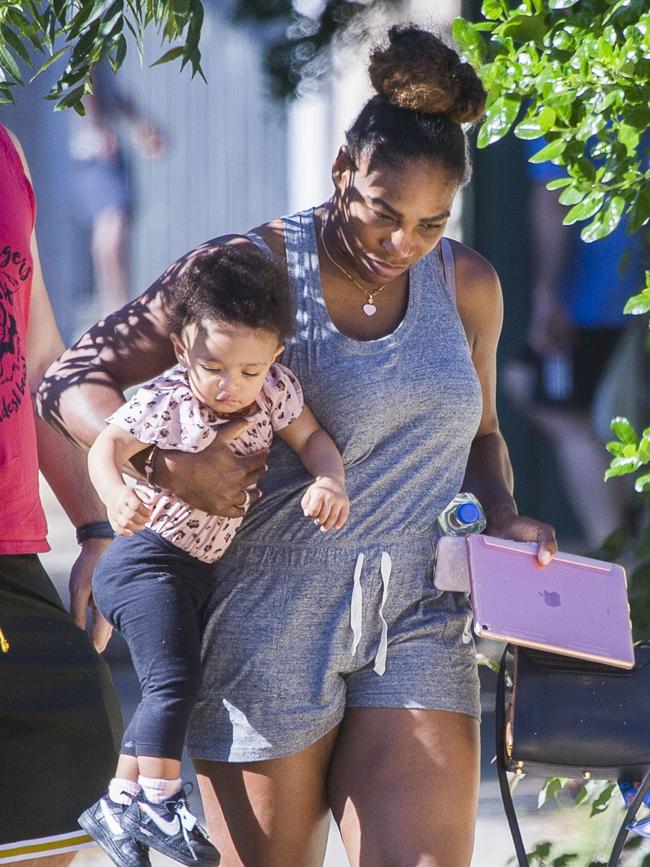 Serena Williams and her husband Alexis Ohanian enjoy an afternoon walk with their 1-year-old daughter Alexia Olympia. Serena's daughter looked seriously cute, toddling her way down the footpath, wearing Nike sneakers like her Mummy. Picture: MediaMode